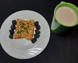 A picture of step 5 of Beans on scrambled egg on toast.