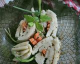 A picture of step 5 of Rava dhokla sushi with cheesy carrot julienned.