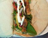 A picture of step 3 of Khubz jarjeer salad rolls.