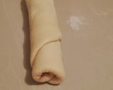 A picture of step 6 of Cinnabon with raisins.