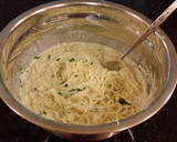A picture of step 9 of Angel Hair Alfredo "Cakes" with Marinara Sauce and Sausage.