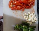 A picture of step 1 of Tomato ghost with bhindi.