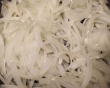 A picture of step 2 of Goat Cheese Crostini with Caramelized Onions.