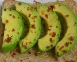 A picture of step 5 of Avocado toast with poppy seeds.