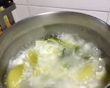 A picture of step 1 of Green Mustard and Salted Egg Soup.