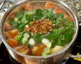 A picture of step 4 of Cambodian fish and pineapple soup.