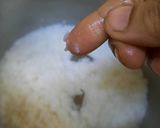 A picture of step 3 of Nolen gurer payesh or Rice kheer with date palm jaggery.