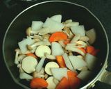 A picture of step 4 of Tomato and Miso Autumn Vegetable Kenchin Soup.