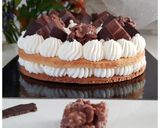 A picture of step 4 of Vanilla & Kinder Number Cake.
