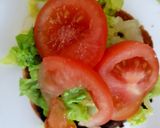 A picture of step 5 of My Chilli Burger with lots of toppings 😘.
