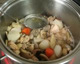A picture of step 10 of Comforting Chikuzen-ni (Japanese Simmered Chicken and Vegetables).