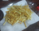 Foto del paso 3 de la receta: Hot dog enrollado y frito con papas fritas