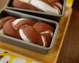 A picture of step 13 of Mini and Cute Cocoa Marble Bread | used two loaf pans.