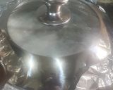 A picture of step 12 of Coconut party jollof rice.