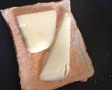 A picture of step 3 of Cheesy egg toast.