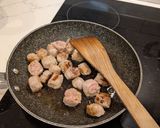 A picture of step 2 of Pasta alla vodka, with pork and sprouts.