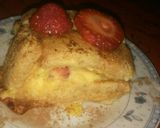Foto del paso 6 de la receta: Arrollado de Vainillas, relleno de postre de vainilla y frutilla