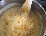 A picture of step 9 of Anti Vampire Cheese Sauce, with Onions and Garlic.