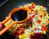 A picture of step 5 of Thai style fried rice with vegetables and tofu.