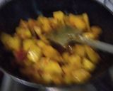 A picture of step 3 of Green papaya with black chana and potatoes.
