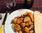 Foto del paso 8 de la receta Alitas al horno con patatas y cebolla