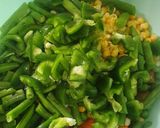 A picture of step 5 of Nigerian fried rice.