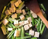 A picture of step 6 of Miso roasted squash with ginger garlic tofu and greens - vegan.