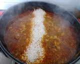 Foto del paso 5 de la receta: Arroz con pollo y caracoles