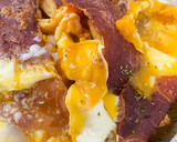 Foto del paso 2 de la receta: Huevos rotos con jamón airfryer