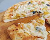 A picture of step 9 of Cheesy Bites Petals Pizza 🍕🍕.