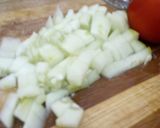 A picture of step 1 of Tomato and Cucumber kichadi.