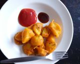 A picture of step 10 of Viazi Karai with Dhania and seasonings.