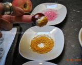 A picture of step 2 of White Chocolate dipped Cherries.