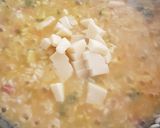 Foto del passaggio 4 della ricetta Risotto allo Zafferano con Speck, fiori di zucca, e provola