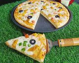 A picture of step 6 of Chicken Tikka Pizza 🍕🍕.