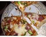 A picture of step 4 of Sausage pizza.