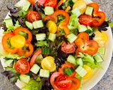 A picture of step 2 of Greek salad with shrimps.