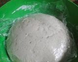 A picture of step 12 of Butter chicken served with buttered Naan bread.