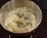 A picture of step 5 of Vanilla Lemon Raspberry Layer Cake with Whipped Cream Buttercream Frosting.