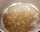 A picture of step 1 of My Smoked Sausage and smoked cheese Pasta.😊.