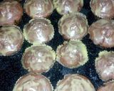 A picture of step 13 of Red and green velvet cupcakes with fudge icing.