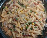 A picture of step 5 of Pink cheese pasta with garlic bread.