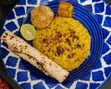 A picture of step 4 of Lemon Lal Msoor Dal Khichdi With Roasted Papad, Chokha, Dahi And Achar.