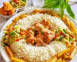 A picture of step 9 of Saucy Crispy chicken with rice fries and vegetable.