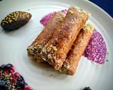 A picture of step 9 of Znoud-el-sit with creamy choco hummus filling and red grape sauce.