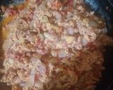 A picture of step 7 of Eggs with Tomato and Onion.