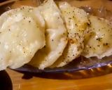 A picture of step 12 of Italian panner ravioli with pink sauce.