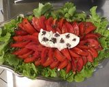 Une image de l'étape 6 de Feuille de chêne aux tomates coeur de bœuf, burrata et fleurs de basilic.
