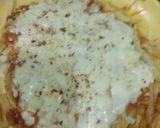 A picture of step 3 of French fries pizza.