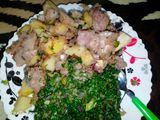 Fried nduma with beef and potato served. with spinach